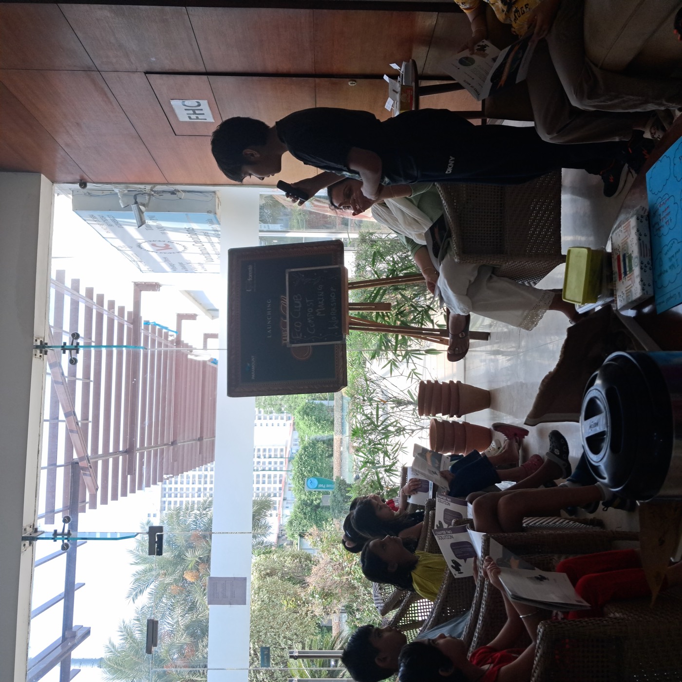 A child speaking into a microphone at the Eco Club compost workshop